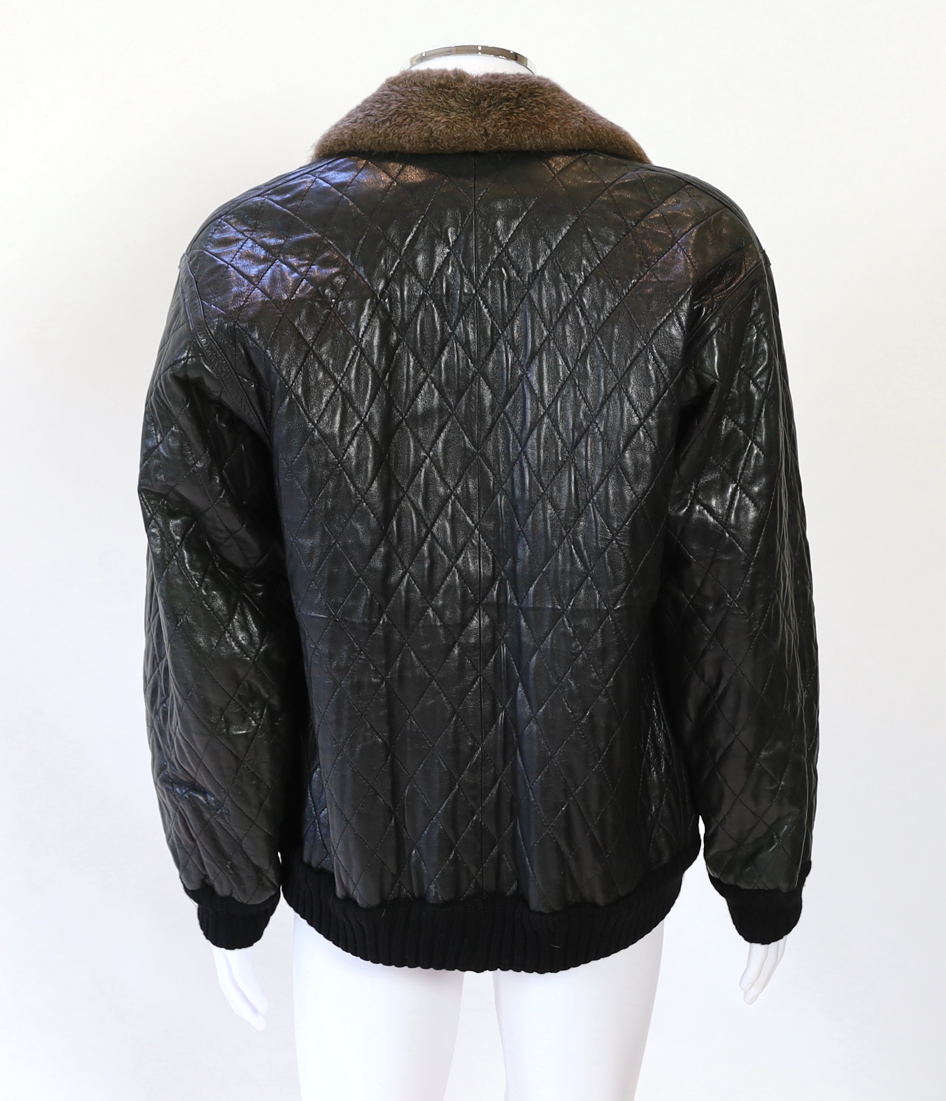 A Yves Saint Laurent Fourrures gentlemen's black quilted leather bomber jacket with fur collar and lining, approx size 42